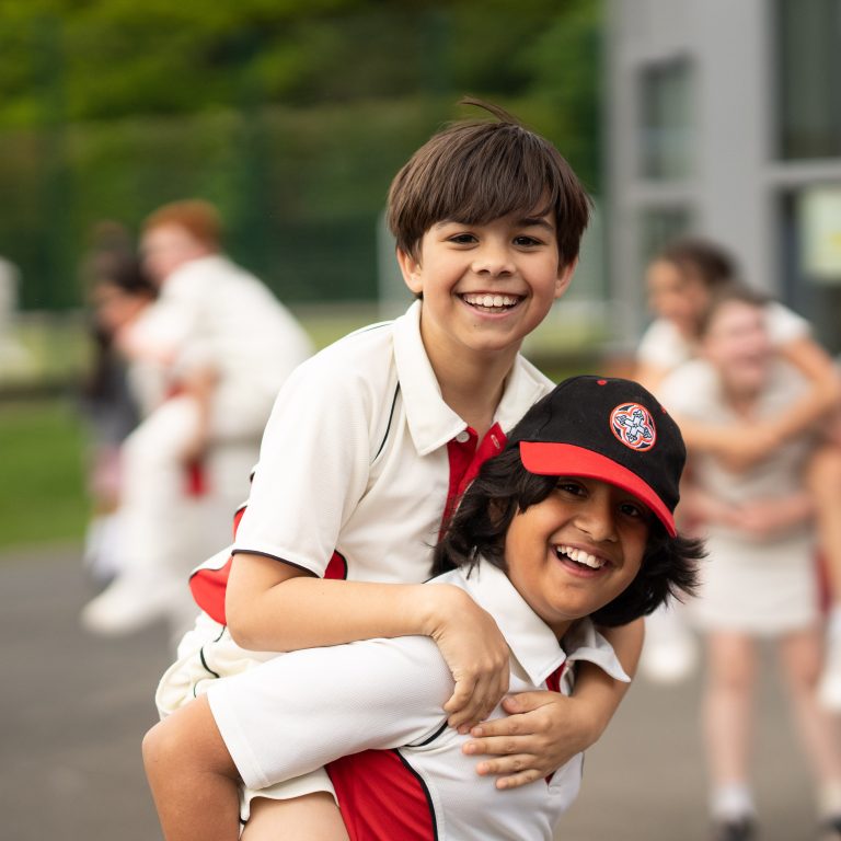 boy giving his friend a piggyback