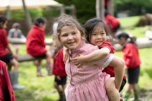 girl giving her peer a piggyback