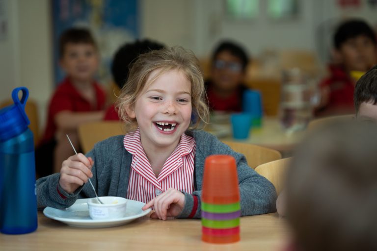 smiling child at lunchtime