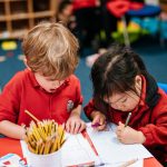 students writing on paper