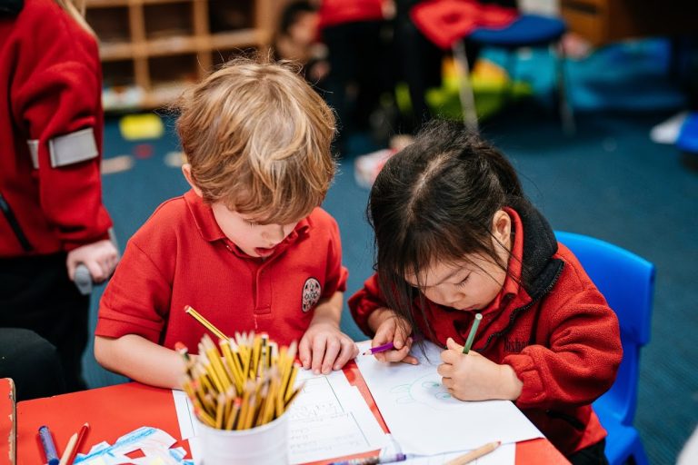 students writing on paper