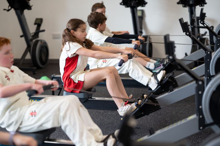 students using the rowing machine