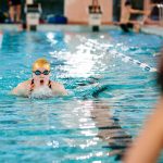 student swimming in the pool