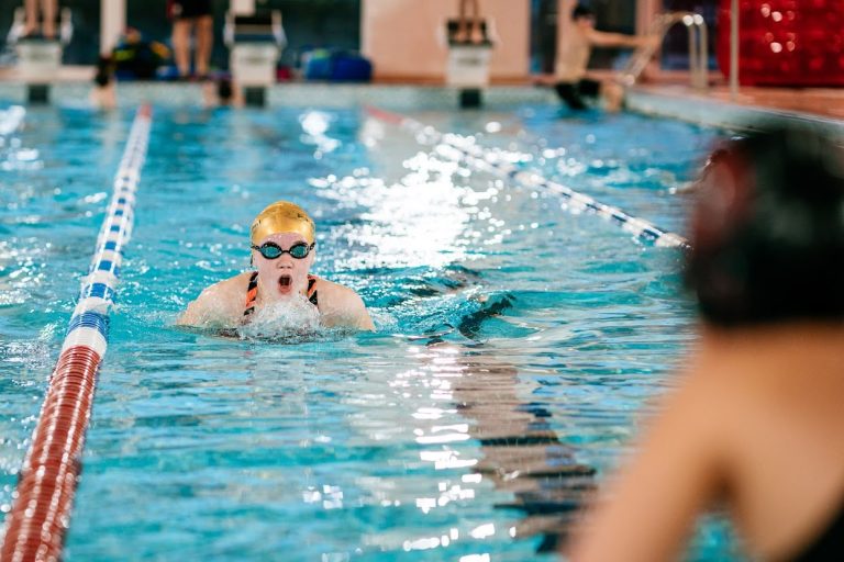 student swimming in the pool