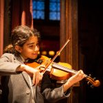 student playing the violin