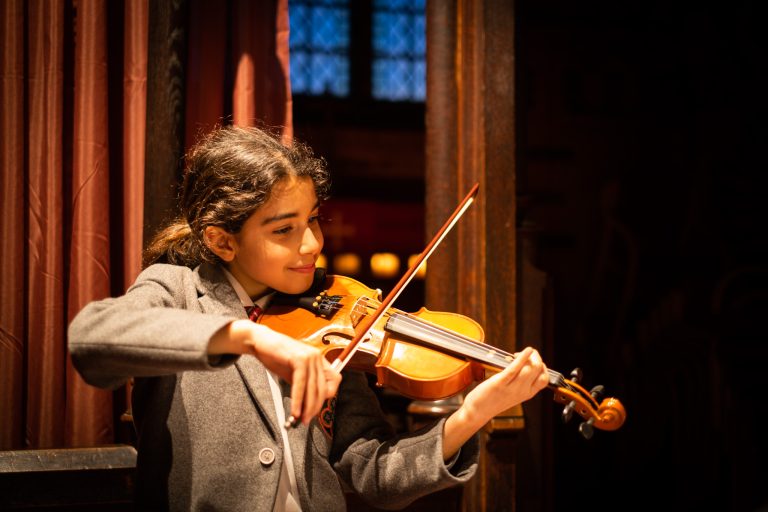 student playing the violin