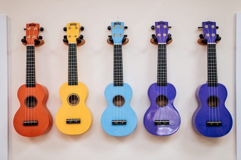 colourful ukuleles mounted on the wall