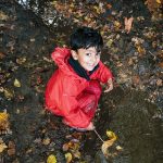 student holding a leaf