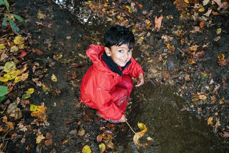 student holding a leaf